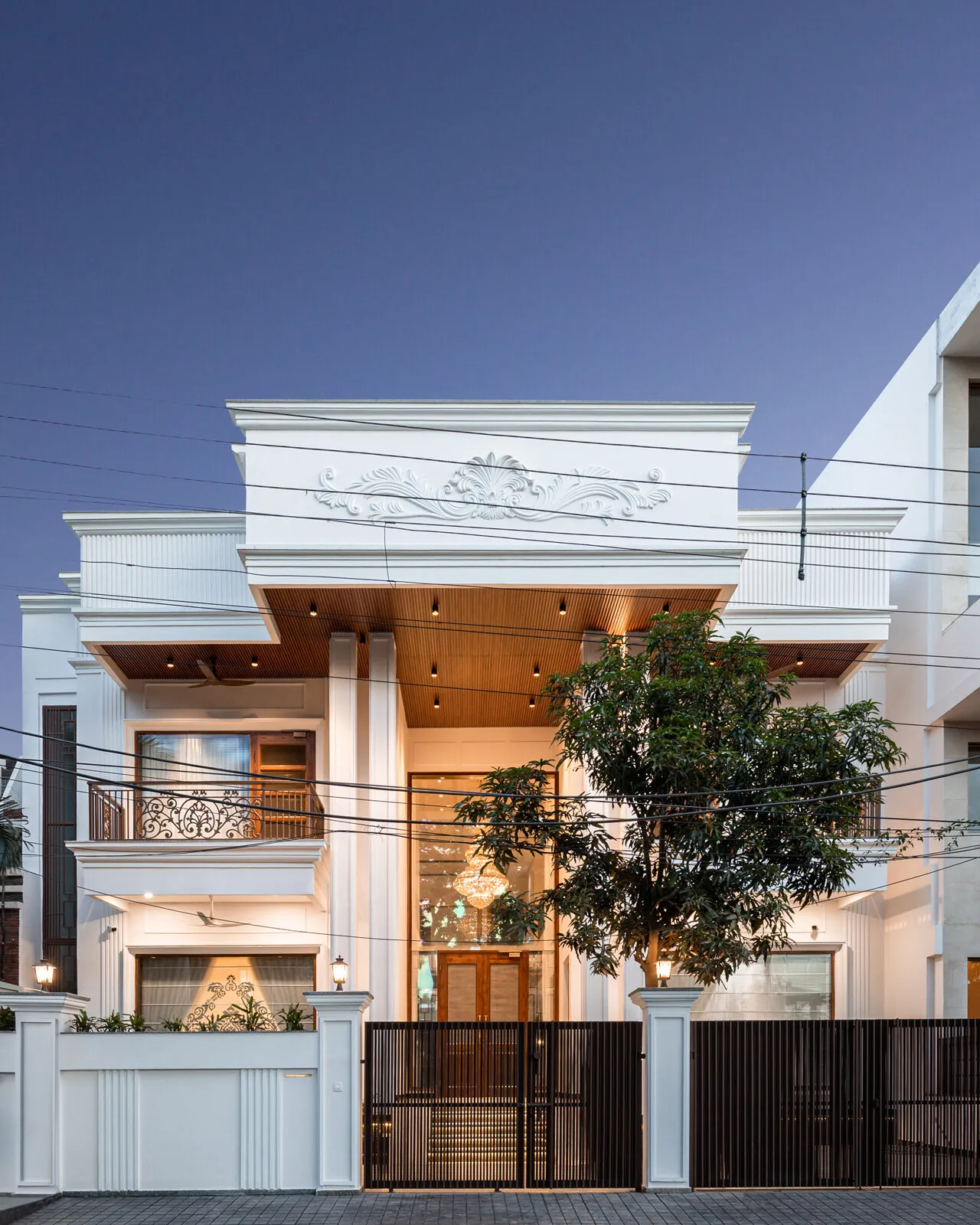 An AKS home glowing at dusk
